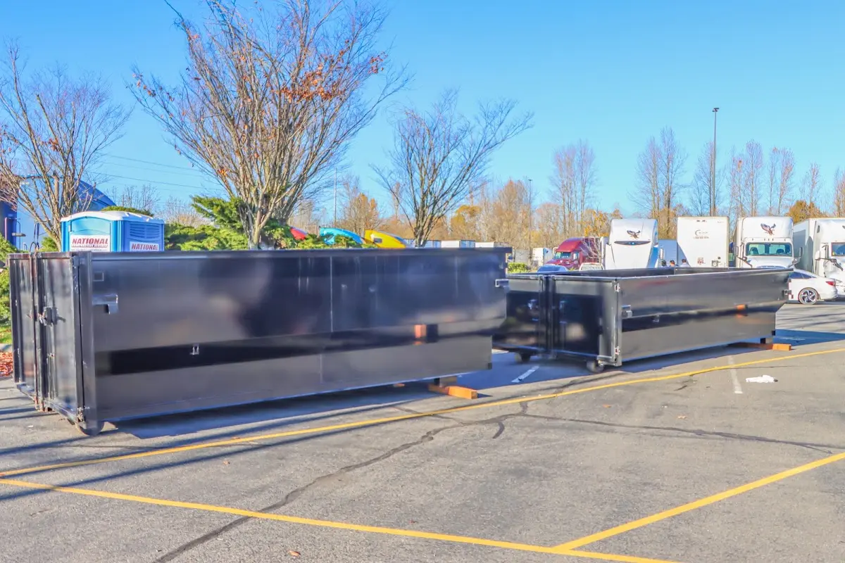 Professional dumpster rental service with roll-off container on residential driveway in Crestview